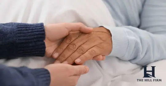 holding hands with someone in a nursing home